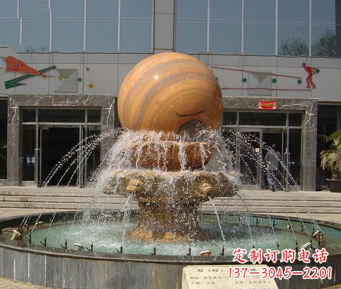 临沂石来运转球晚霞红风水球石雕